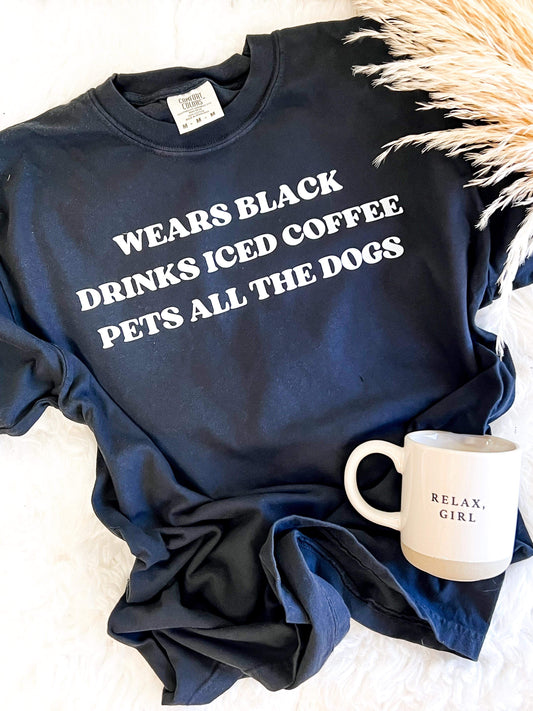 Wears black, pets all the dogs